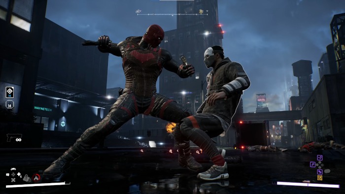 Red Hood finishing off a thug. 